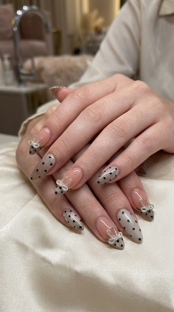Elegant Bow Nail Art 2026 – Nude Polka Dot Nail Trend Guide 7 Close up of models 202603192221