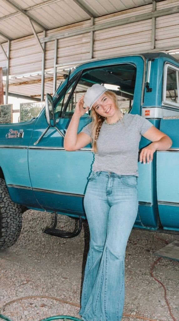 Modern Country Girl Fashion Style 2026 – Casual Western Outfit Guide for Women 2 Woman standing beside pickup truck 2167eb40d4
