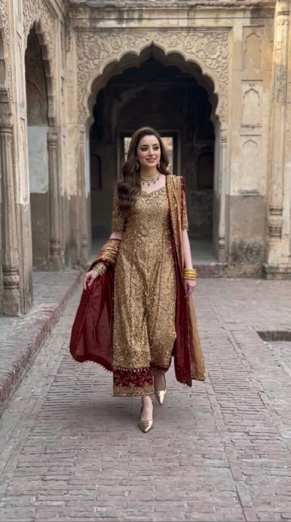 Royal Maroon and Gold Traditional Outfit Ideas 2026 – Luxury Wedding & Eid Looks 2 Woman walking in 202603251204