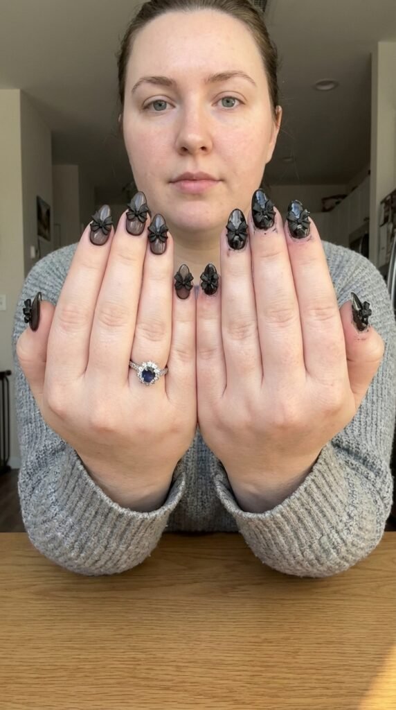 Woman showing nail 202604101536