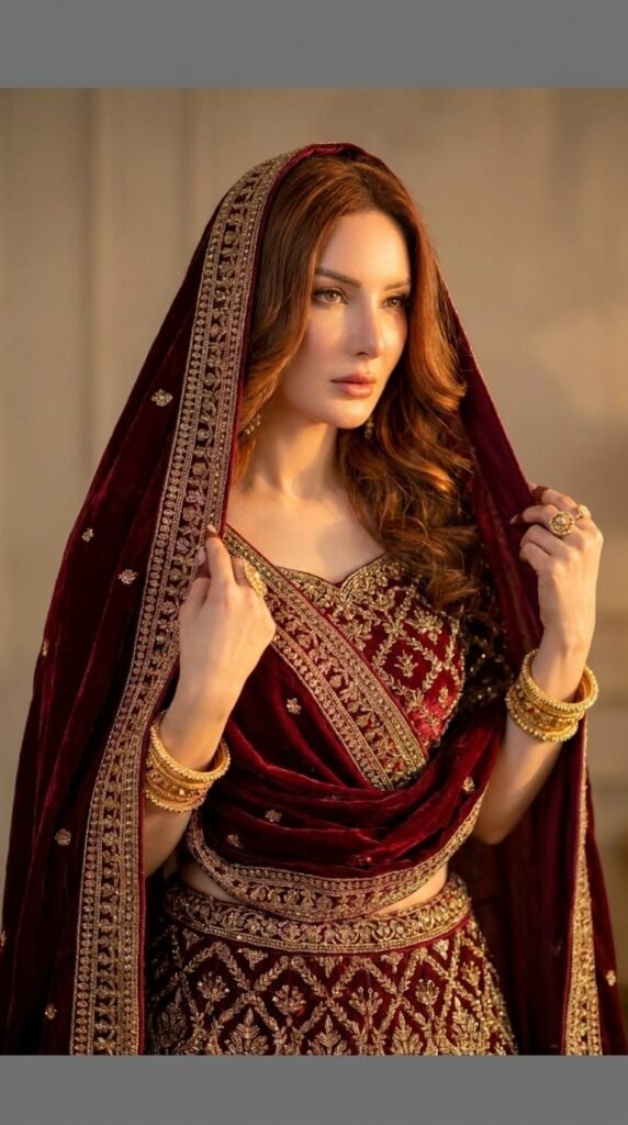 Female model wearing maroon lehenga 202605161248