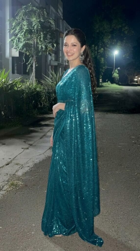 Model wearing teal saree smiling 202605161627